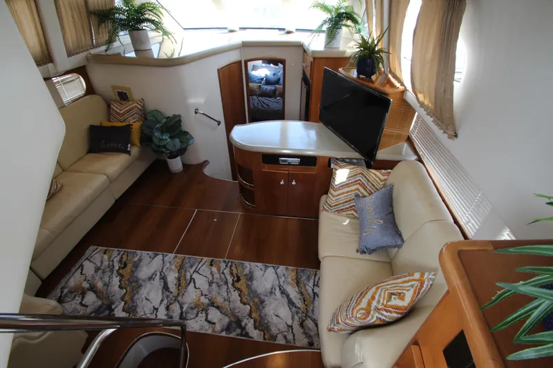 Slide: The Image of Luxurious interior of 2002 Carver 366 Motor Yacht with elegant seating and decor. - 25