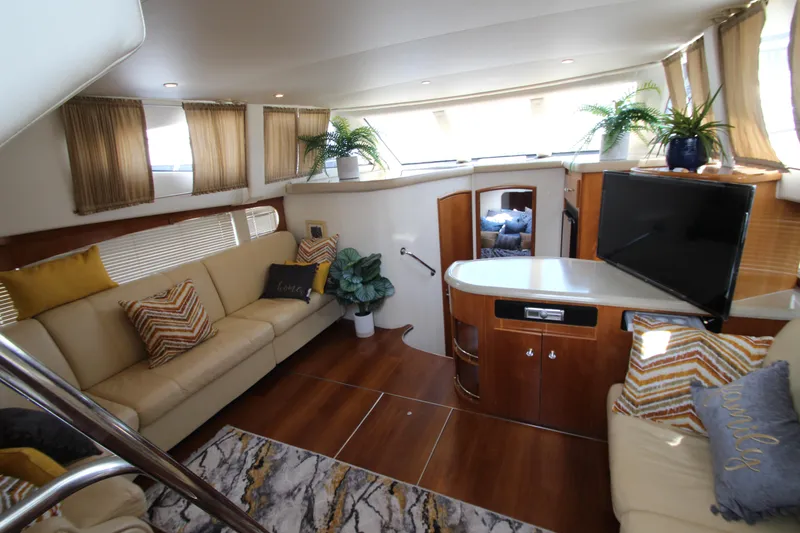 Slide: The Image of Luxurious interior of 2002 Carver 366 Motor Yacht with elegant seating and modern decor. - 26