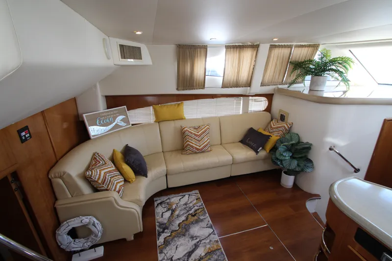 Slide: The Image of Interior of 2002 Carver 366 Motor Yacht with beige sofa and decorative pillows. - 27