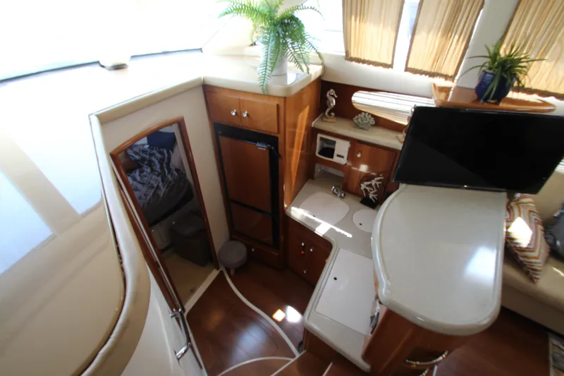 Slide: The Image of Interior of 2002 Carver 366 Motor Yacht with kitchenette and seating area. - 29