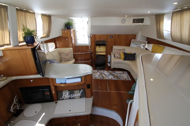 Slide: The Image of Interior of 2002 Carver 366 Motor Yacht with cozy seating and modern amenities. - 31