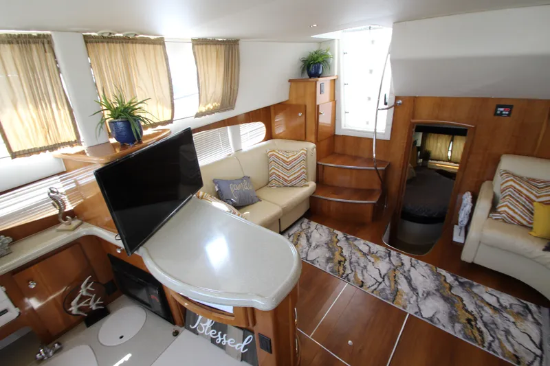 Slide: The Image of Interior of 2002 Carver 366 Motor Yacht with cozy seating and modern decor. - 34