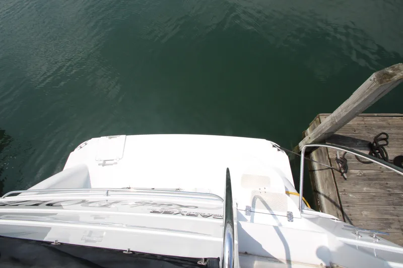 Slide: The Image of 2002 Carver 366 Motor Yacht docked at a wooden pier. - 5