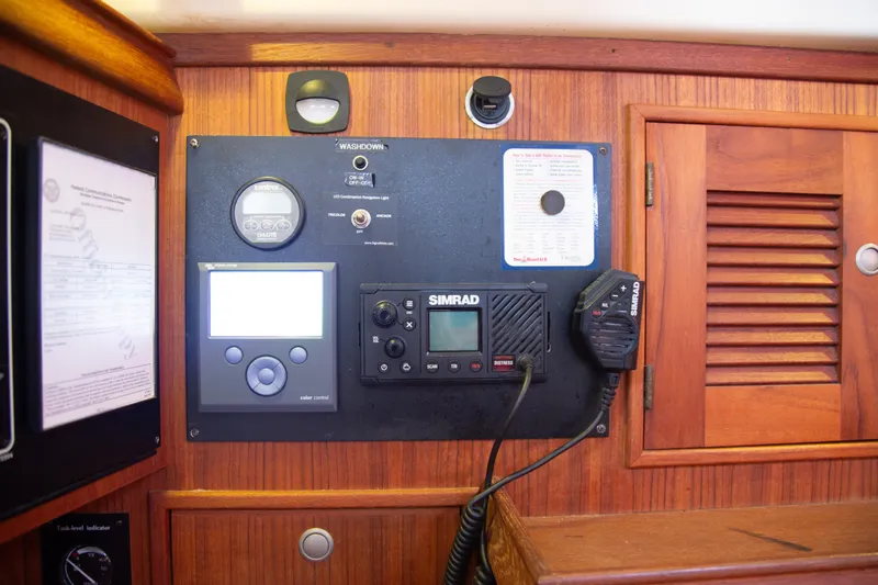 Slide: The Image of Control panel of a 1999 Island Packet 380 sailboat with navigation and communication equipment. - 18