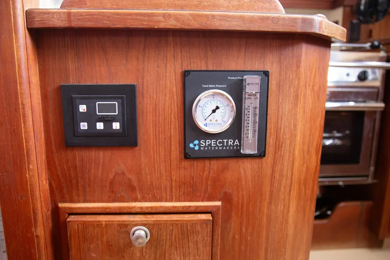 Slide: The Image of Control panel and Spectra watermaker on 1999 Island Packet 380 yacht interior. - 19