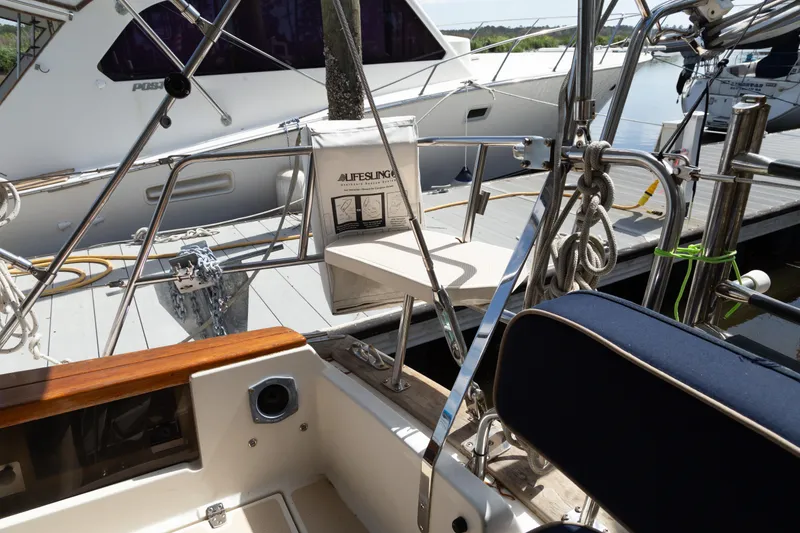 Slide: The Image of Cockpit view of a 1999 Island Packet 380 sailboat docked at a marina. - 34