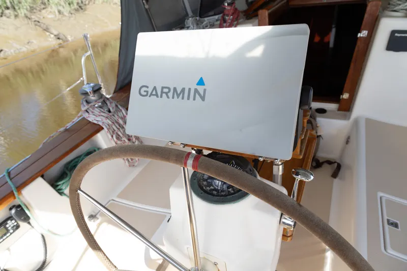 Slide: The Image of Steering wheel and Garmin navigation on 1999 Island Packet 380 sailboat. - 36