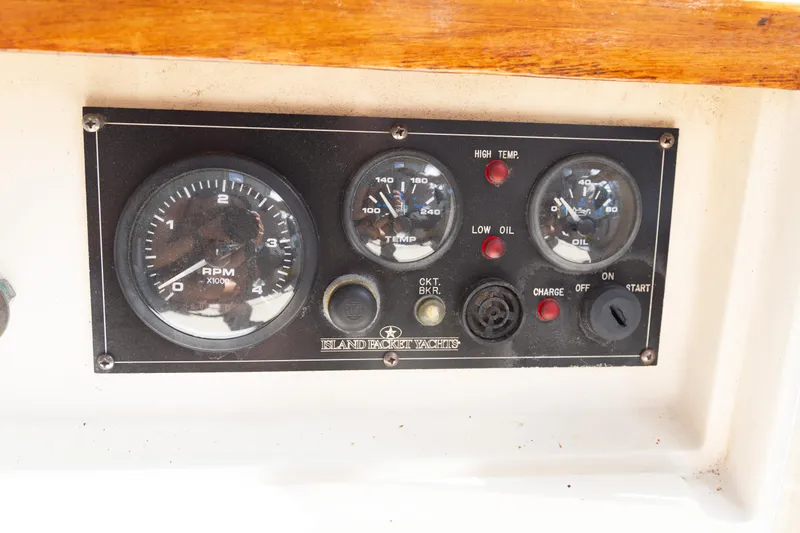 Slide: The Image of Control panel of a 1999 Island Packet 380 sailboat with gauges and indicators. - 38
