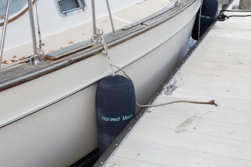 Slide: The Image of Island Packet 380 sailboat docked with fenders, 1999 model. - 39