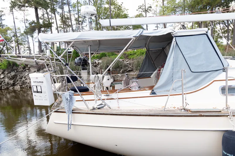 Slide: The Image of Island Packet 380 sailboat, 1999 model, docked with canopy and equipment visible. - 41