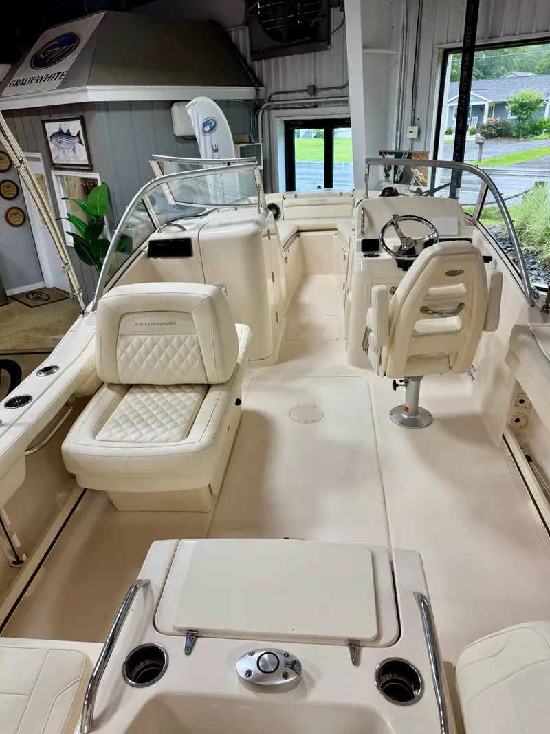 Slide: The Image of 2025 Grady-White Freedom 215 boat interior with luxurious seating and modern controls. - 3