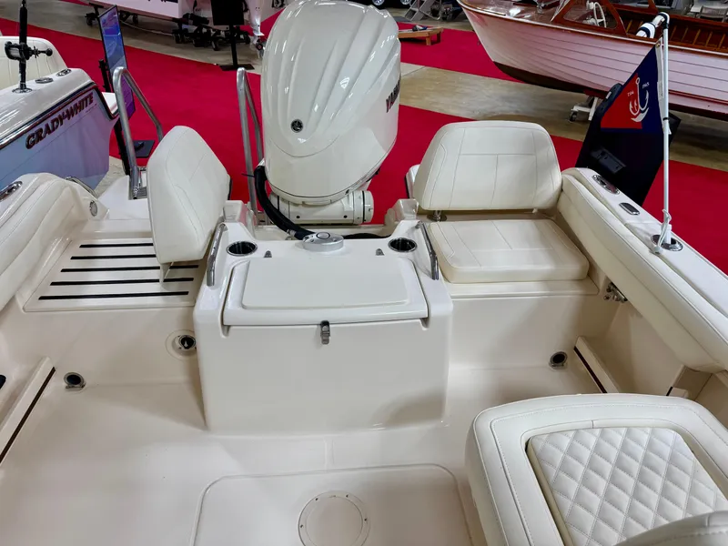 Slide: The Image of 2025 Grady-White Freedom 215 boat interior with seating and Yamaha outboard motor. - 4