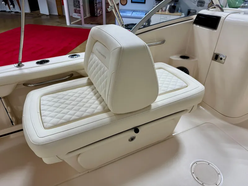 Slide: The Image of 2025 Grady-White Freedom 215 boat interior with luxurious white seating. - 5