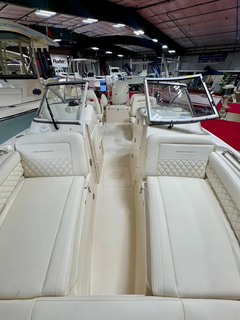 Slide: The Image of 2025 Grady-White Freedom 215 boat interior with luxurious seating and open layout. - 9