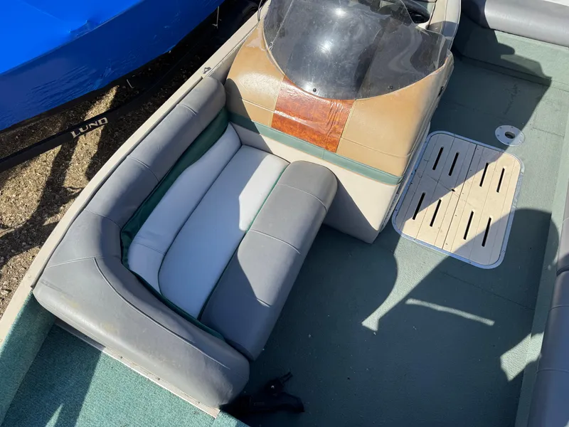 Slide: The Image of 1999 Sun Tracker Party Deck 21 dashboard with steering wheel and gauges. - 13