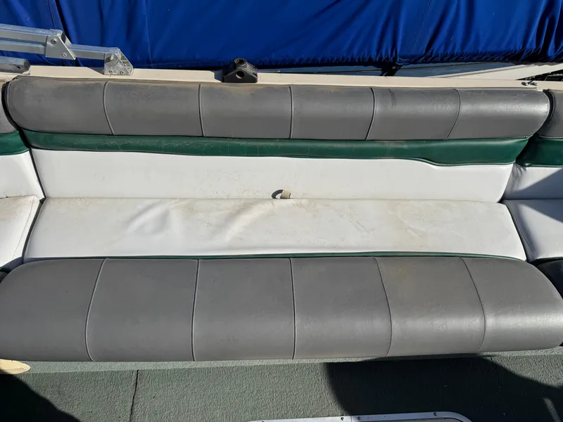 Slide: The Image of 1999 Sun Tracker Party Deck 21 boat on trailer in indoor storage. - 6