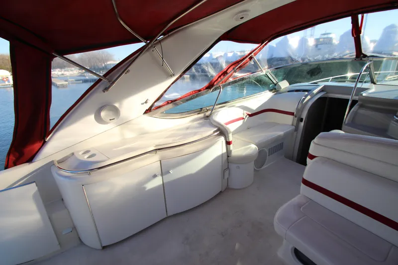 Slide: The Image of 2001 Formula 400 Super Sport yacht interior with red canopy and white seating. - 12