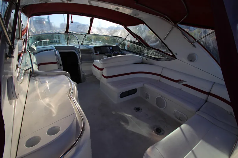 Slide: The Image of 2001 Formula 400 Super Sport boat interior with white seating and red accents. - 13