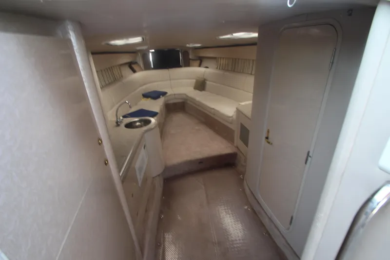 Slide: The Image of Interior of 2001 Formula 400 Super Sport boat with seating and kitchenette. - 14