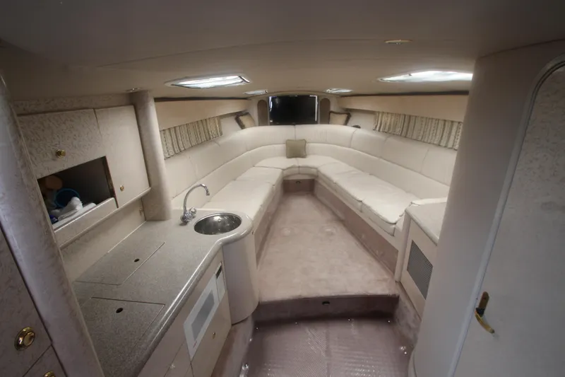 Slide: The Image of Interior of 2001 Formula 400 Super Sport boat with spacious seating and kitchenette. - 15