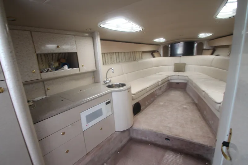 Slide: The Image of 2001 Formula 400 Super Sport yacht interior with kitchenette and seating area. - 17