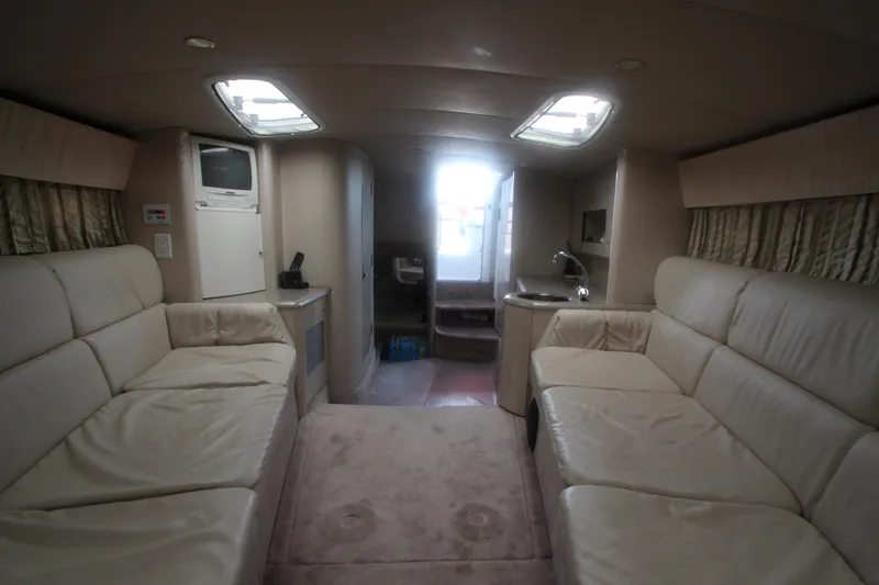 Slide: The Image of Interior of 2001 Formula 400 Super Sport yacht with beige seating and skylights. - 19