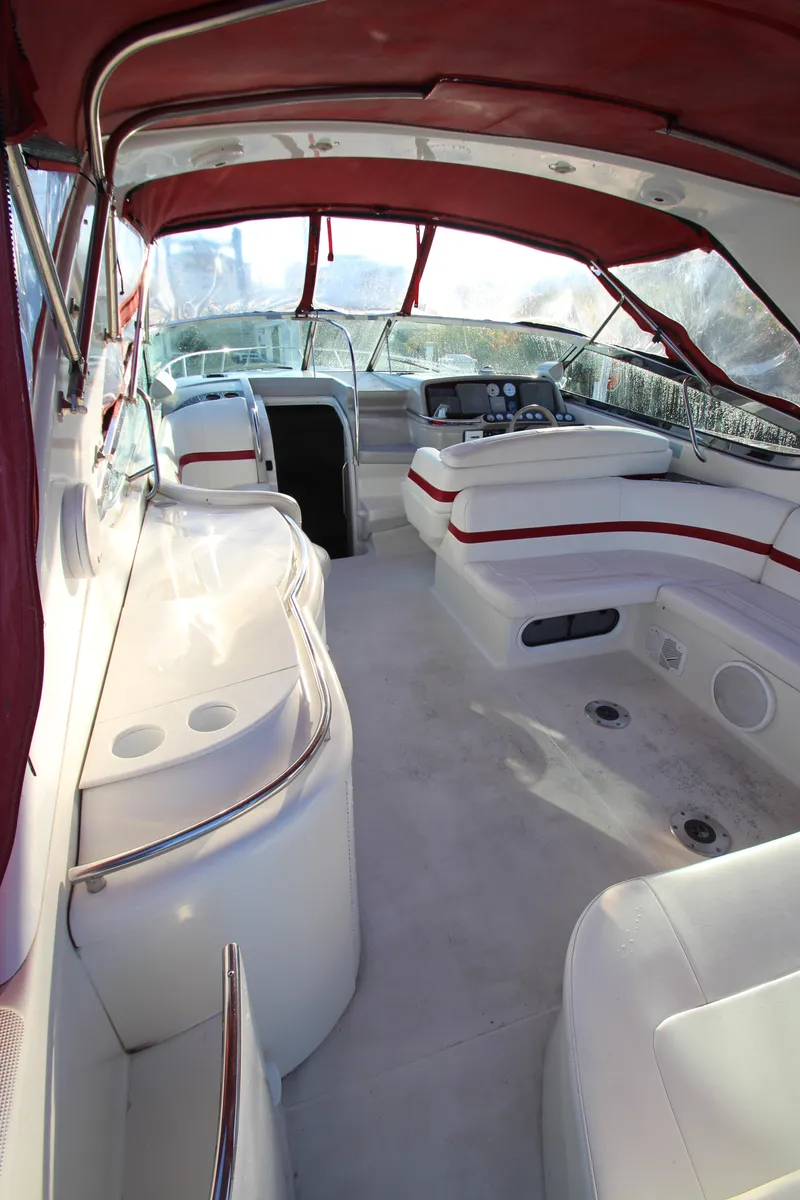 Slide: The Image of 2001 Formula 400 Super Sport boat interior with red canopy and white seating. - 2