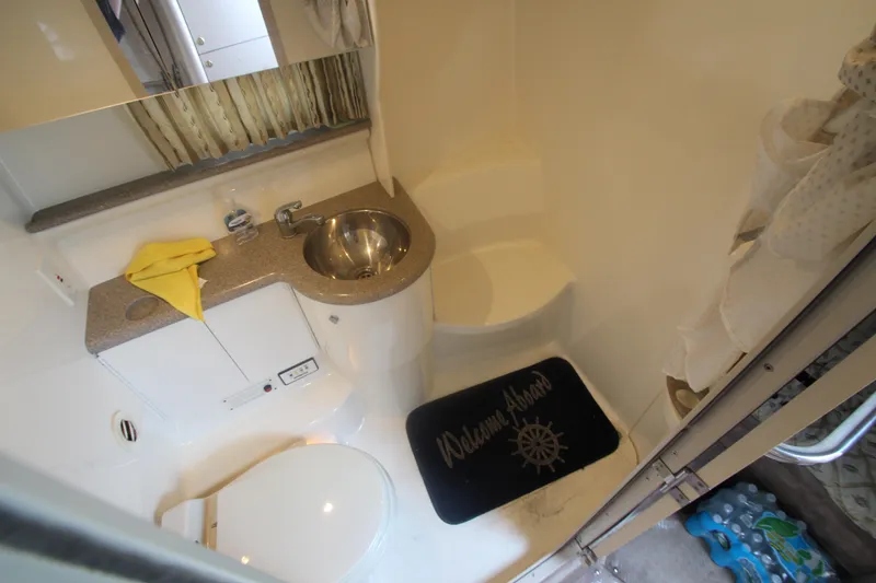 Slide: The Image of Bathroom interior of 2001 Formula 400 Super Sport boat with sink and toilet. - 23