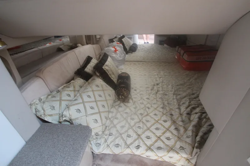 Slide: The Image of Interior cabin of a 2001 Formula 400 Super Sport boat with patterned bedding. - 24