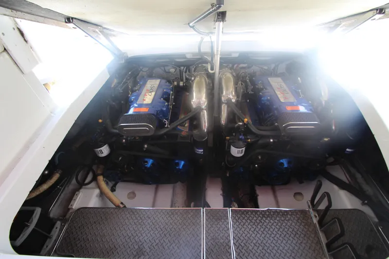 Slide: The Image of Engine compartment of a 2001 Formula 400 Super Sport boat, showcasing dual engines. - 27
