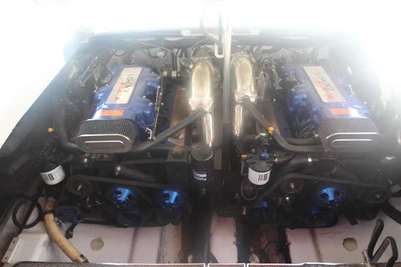 Slide: The Image of Engine compartment of a 2001 Formula 400 Super Sport boat, featuring dual high-performance engines. - 28