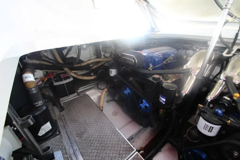Slide: The Image of Engine room of a 2001 Formula 400 Super Sport boat, showcasing mechanical components. - 29