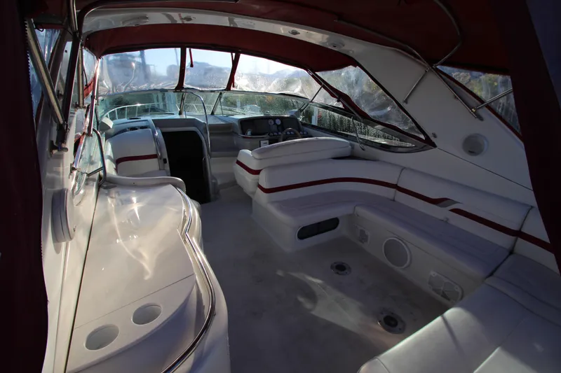 Slide: The Image of Interior of a 2001 Formula 400 Super Sport boat with red accents and seating. - 3