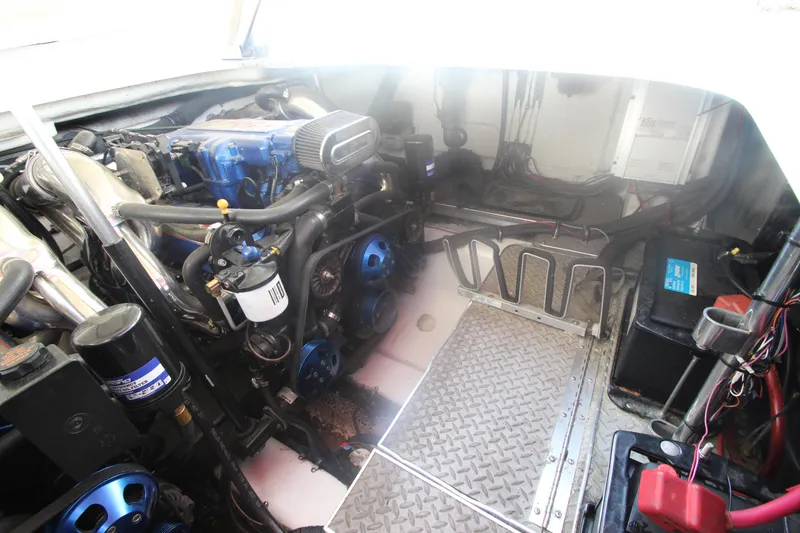 Slide: The Image of Engine room of a 2001 Formula 400 Super Sport boat, showcasing mechanical components. - 30
