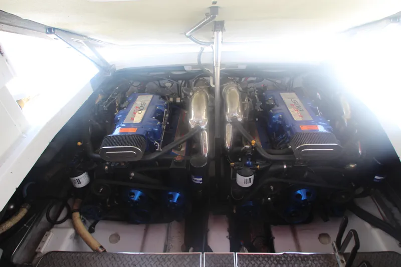 Slide: The Image of Engine compartment of a 2001 Formula 400 Super Sport boat, featuring dual engines. - 31