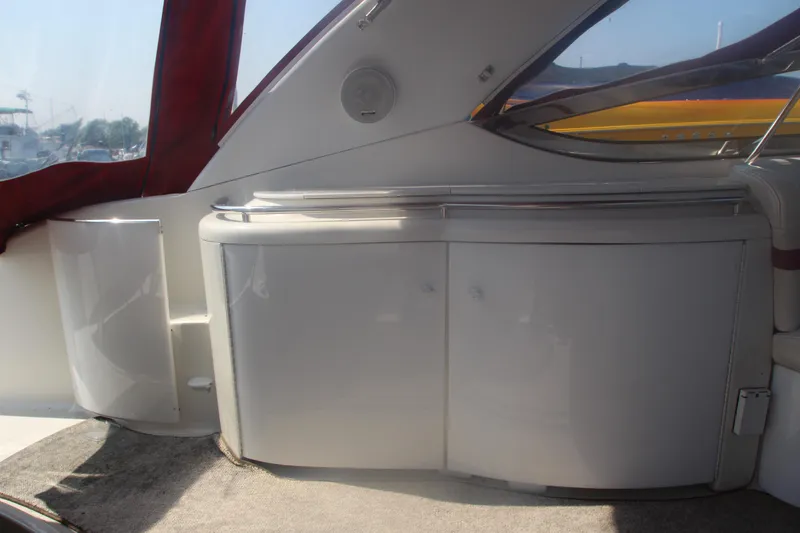 Slide: The Image of Interior view of a 2001 Formula 400 Super Sport boat with white cabinetry. - 32