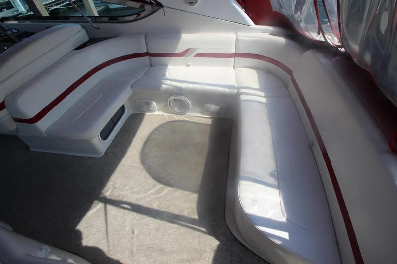 Slide: The Image of 2001 Formula 400 Super Sport boat interior with white and red seating. - 34