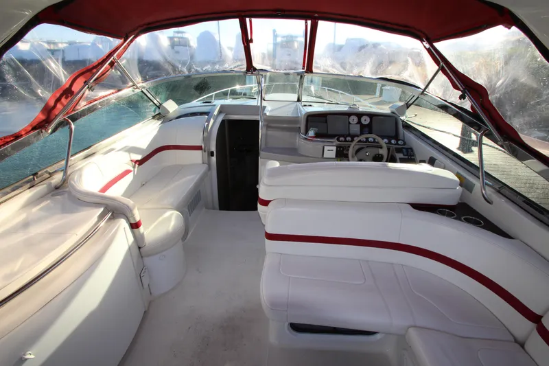 Slide: The Image of 2001 Formula 400 Super Sport boat interior with white and red seating, sleek design. - 4