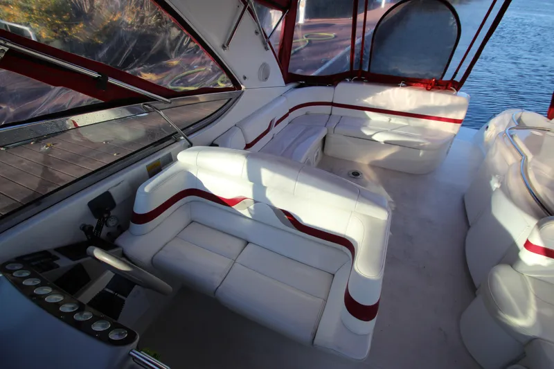 Slide: The Image of Luxurious interior of a 2001 Formula 400 Super Sport boat with white and red seating. - 7