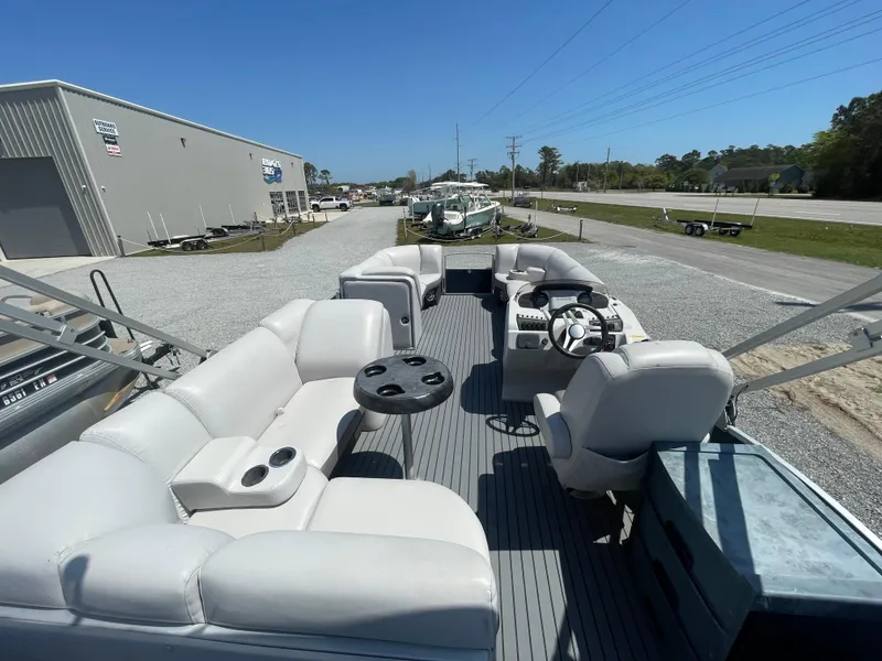 Slide: The Image of 2017 Godfrey 255 Sweetwater Premium pontoon boat with spacious seating and modern helm. - 11