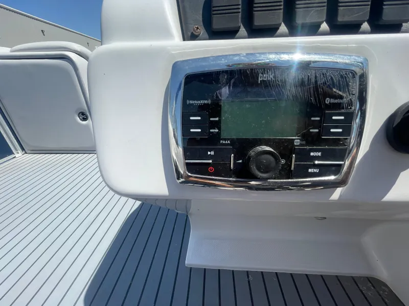 Slide: The Image of Control panel on a 2017 Godfrey 255 Sweetwater Premium boat, featuring a radio system. - 12