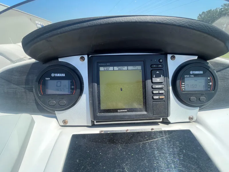 Slide: The Image of Dashboard of a 2017 Godfrey Sweetwater Premium boat with Yamaha gauges and Garmin GPS. - 14