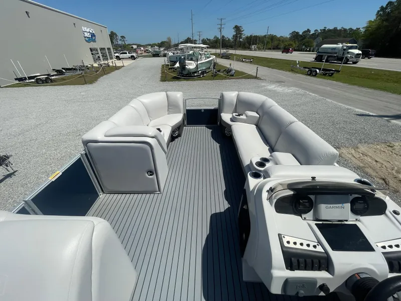Slide: The Image of 2017 Godfrey 255 Sweetwater Premium pontoon boat with spacious seating and modern dashboard. - 16