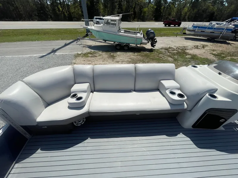 Slide: The Image of 2017 Godfrey 255 Sweetwater Premium boat with spacious seating and cup holders. - 18