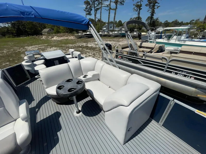 Slide: The Image of 2017 Godfrey 255 Sweetwater Premium pontoon boat with comfortable seating and table. - 20