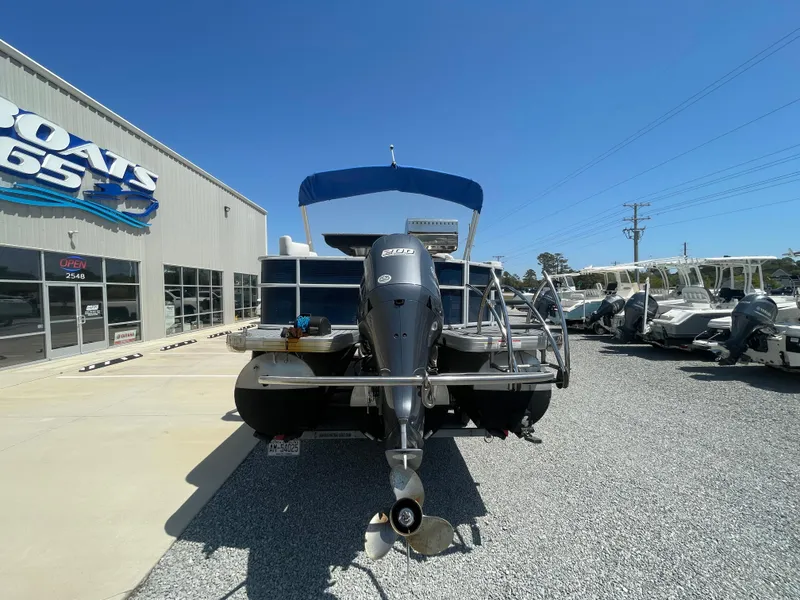 Slide: The Image of 2017 Godfrey 255 Sweetwater Premium pontoon boat at dealership, rear view. - 6