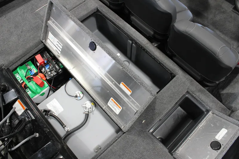 Slide: The Image of 2025 Tracker Pro Team 175 boat storage compartments and battery setup. - 14