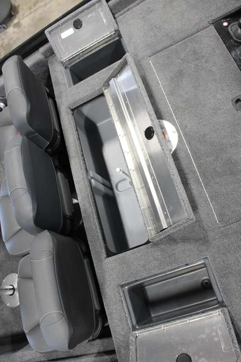 Slide: The Image of 2025 Tracker Pro Team 175 boat interior with storage compartments and seating. - 15