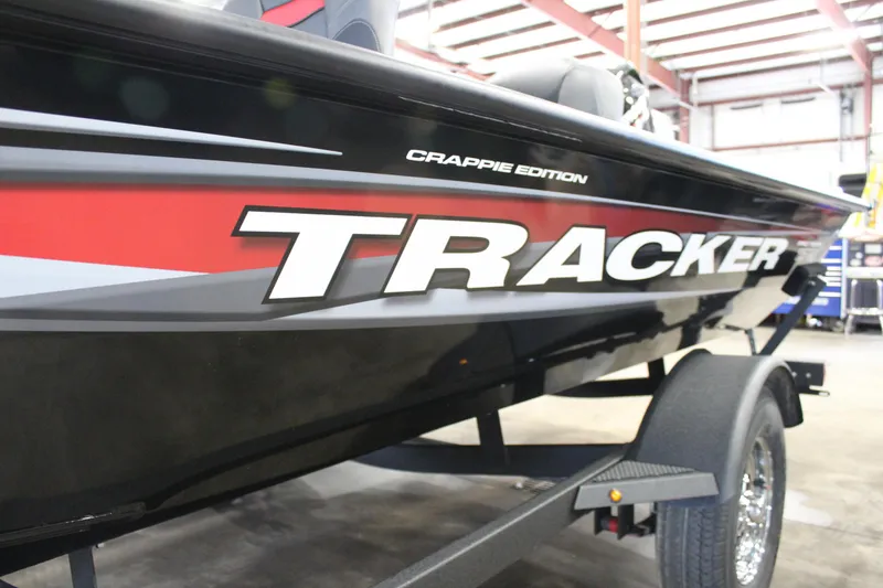 Slide: The Image of 2025 Tracker Pro Team 175 Crappie Edition boat in a garage setting. - 4