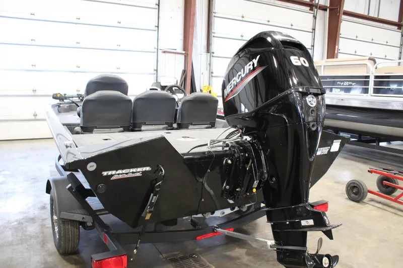 Slide: The Image of 2025 Tracker Pro Team 175 boat with Mercury 60 engine in a garage. - 5